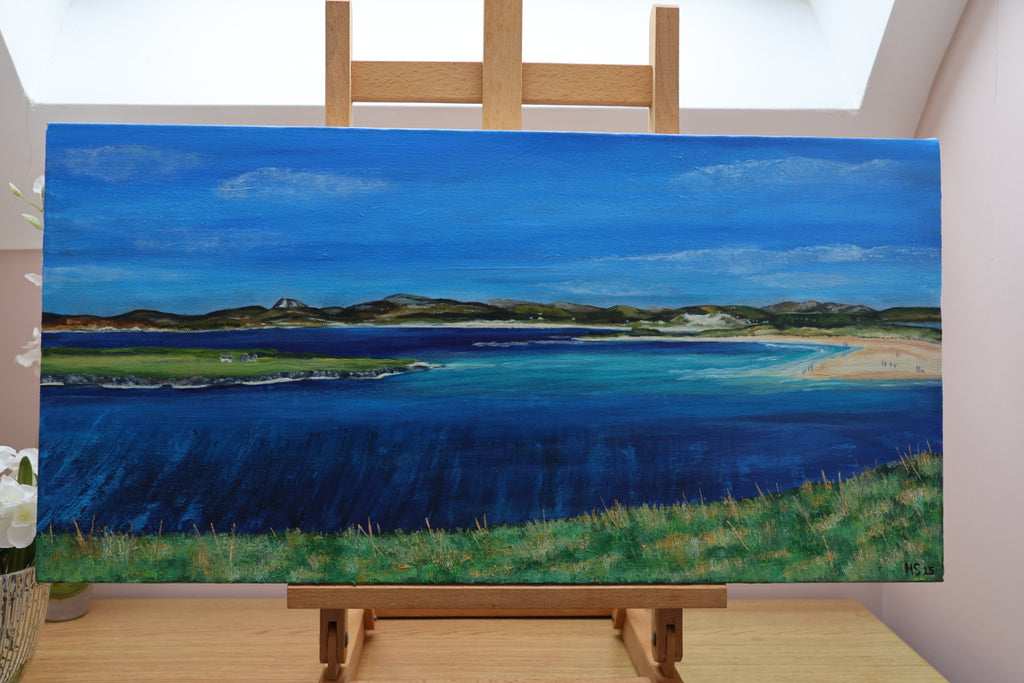Painting of the coastal landscape of Narin Strand on an easel