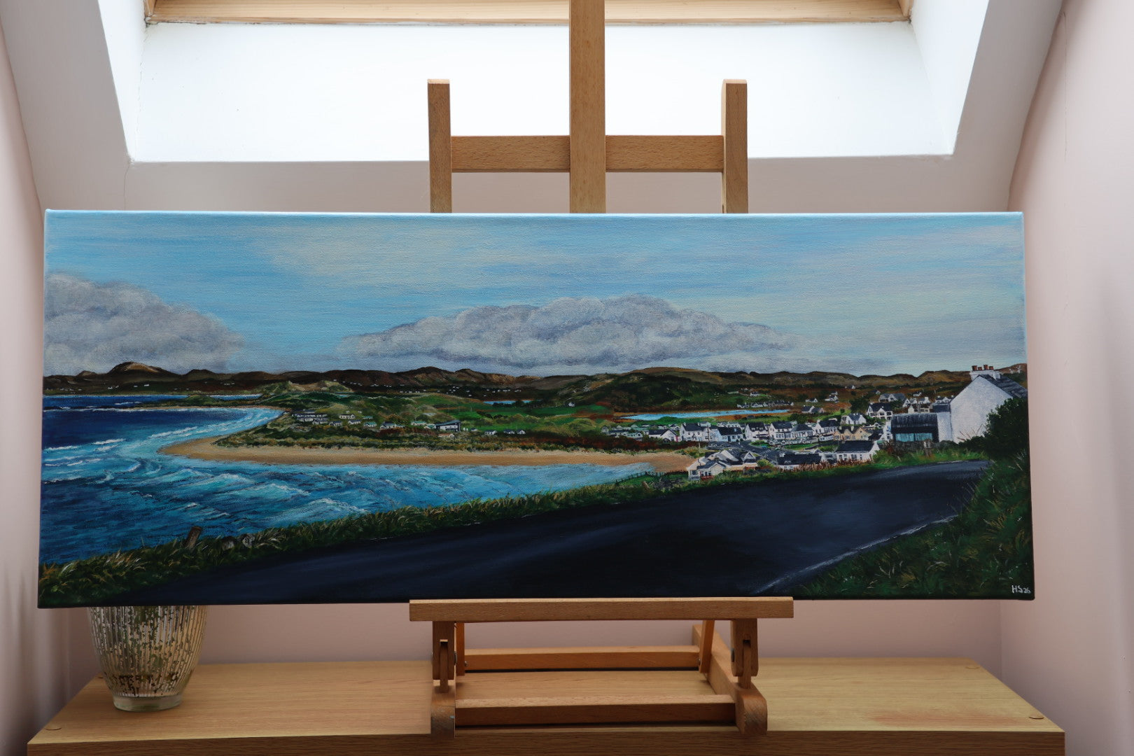 Panoramic landscape painting of Narin village, Narin Strand and the sea on a wooden easel